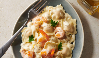 Ravioli tomates confites creme safranee et crevettes